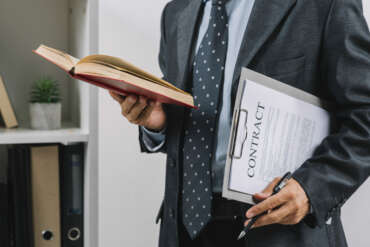 businessman-holding book clipboard with contract