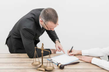 Lawyer pointing at how to file a criminal complaint